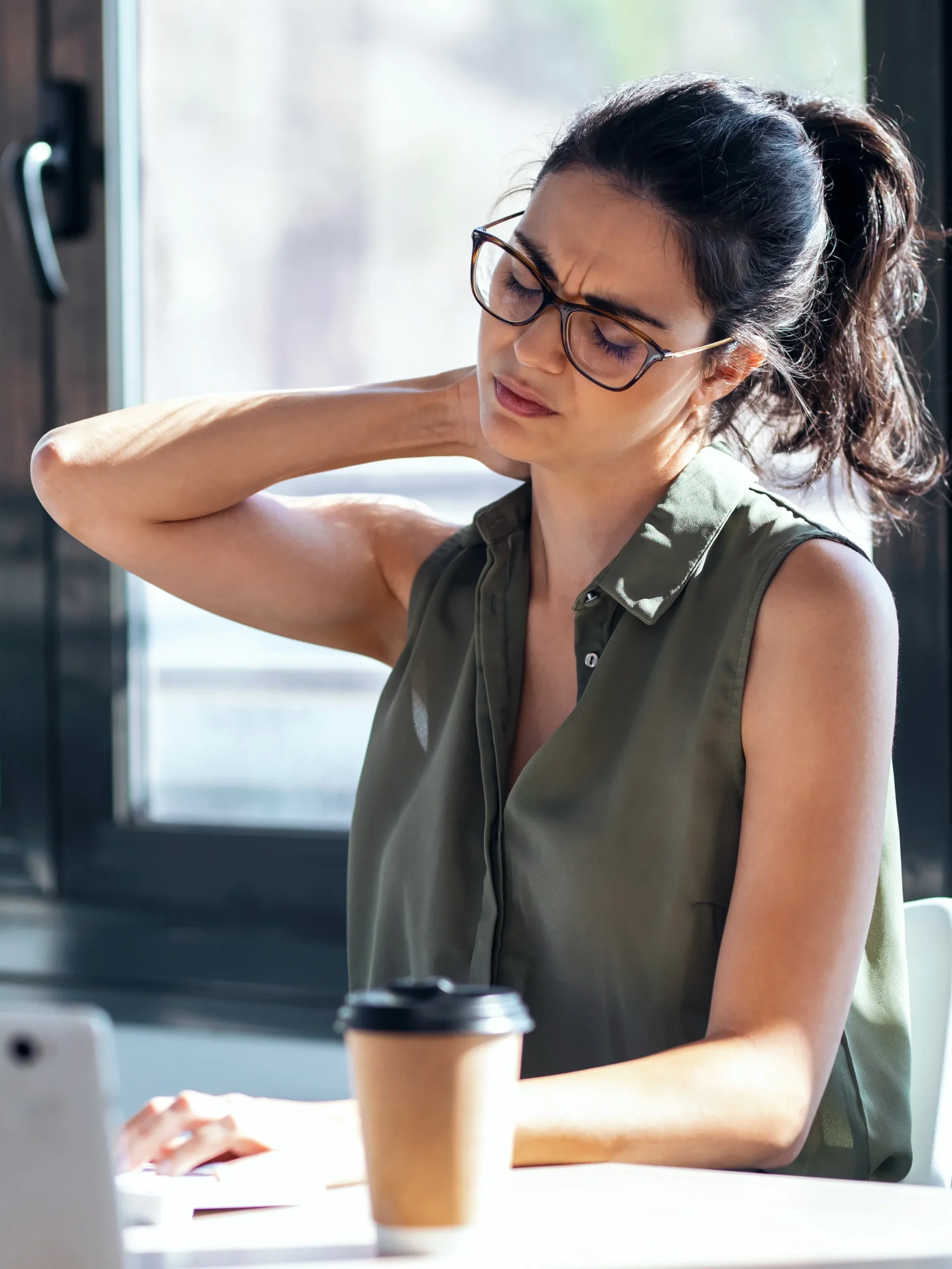 Woman at desk in neck pain