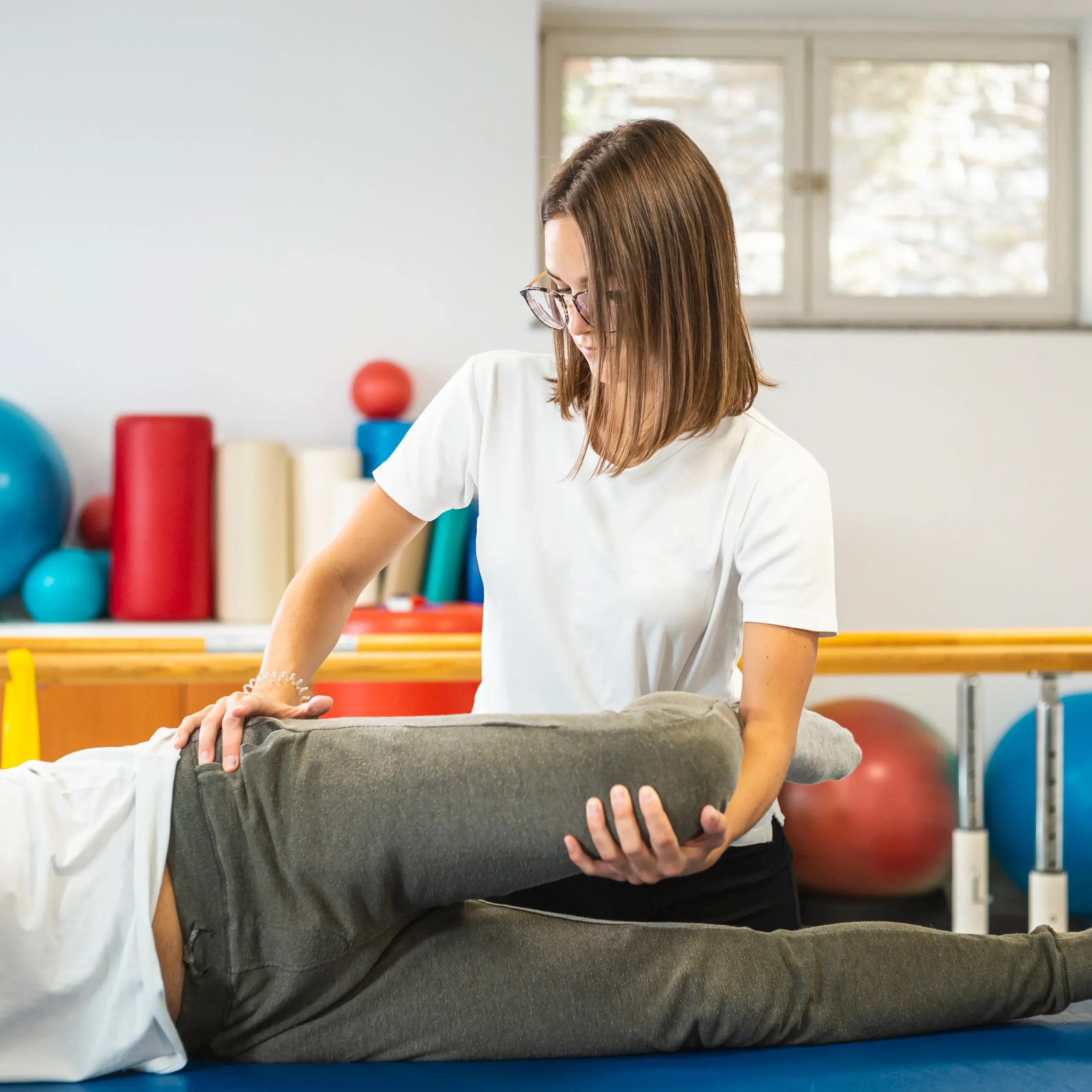 Therapeutic hip exercise with patient on table